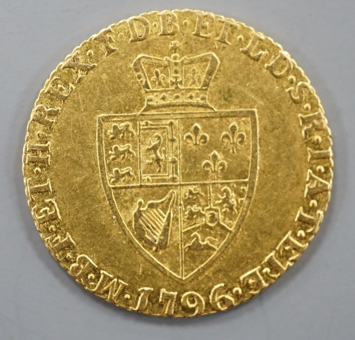 A 1796 gold half guinea, about VF.